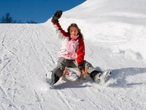 Sledding at the lake Weissensee